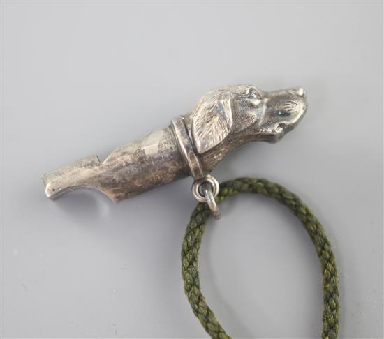 A late Victorian silver whistle with dogs head terminal, by Constantine & Floyd, Birmingham, 1894, 42mm.